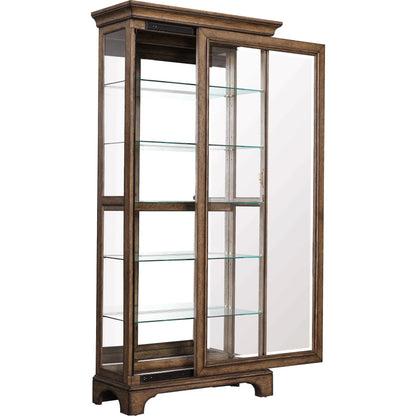 Traditional Sliding Door Curio with Glass Shelves and LED Light by Pulaski Furniture in chestnut. Made from oak wood veneers in a unique style.