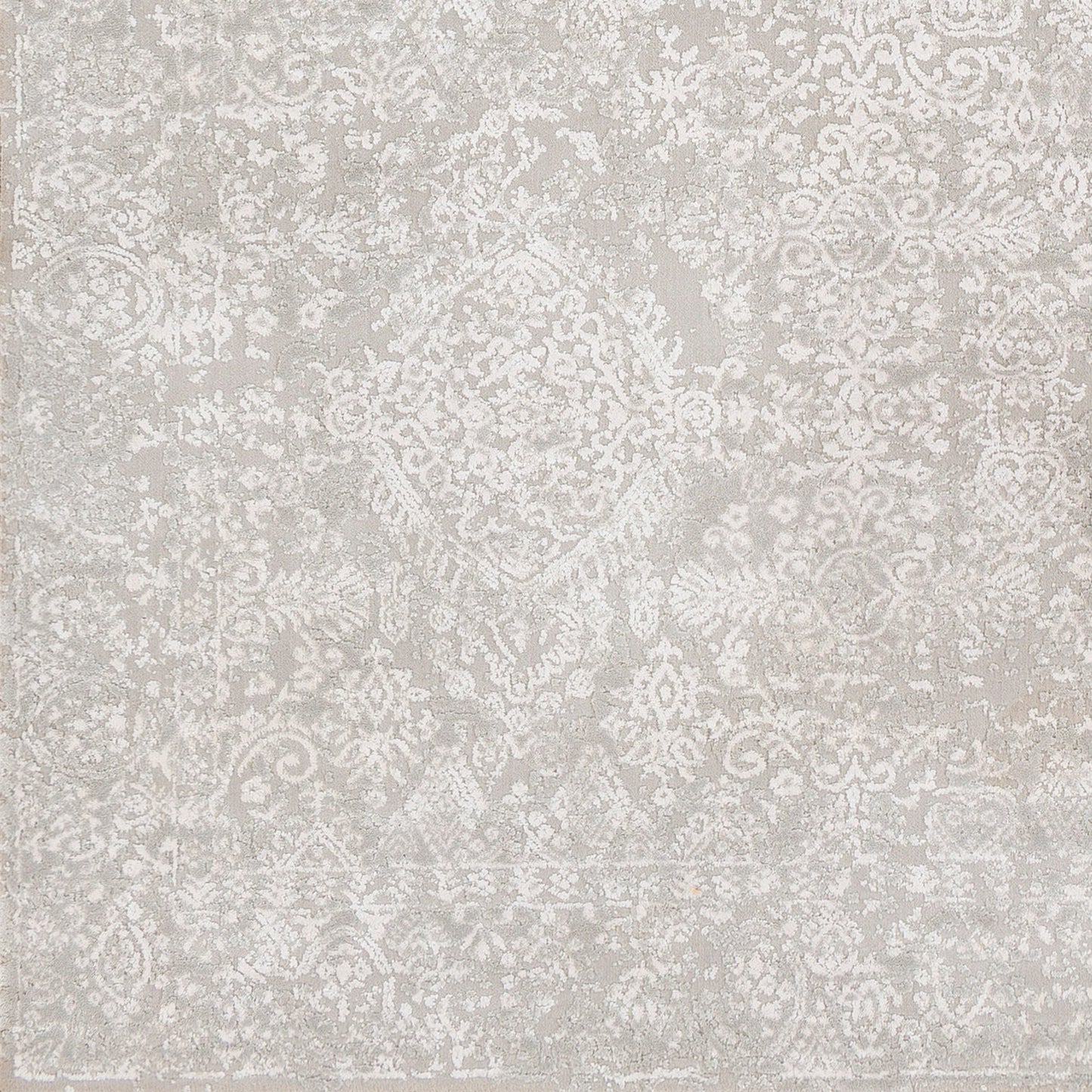 011 99609-41720,SI-1841729,SI-1841731,SI-1841732 | Closeup | Aisha Rug by Livabliss in light gray, off-white. Made from 70% viscose, 30% polyester in a traditional style.