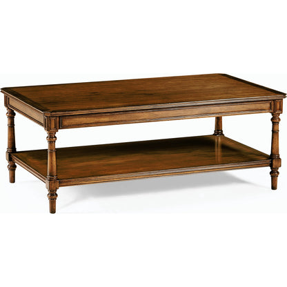 Casual Accents Victorian Style Walnut Cocktail Table by Jonathan Charles in medium walnut. Made from acacia in a traditional style.