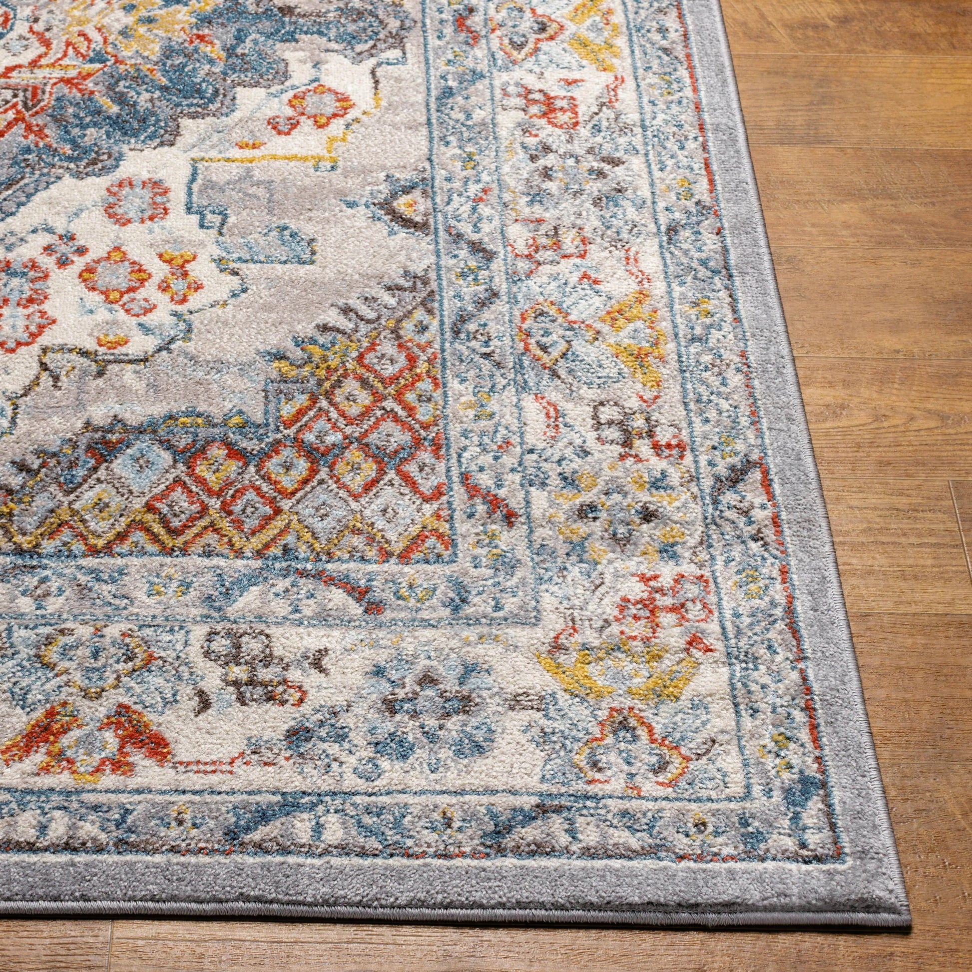 Ankara Rug by Livabliss in gray, taupe, ice blue, dark blue, cream, rust. Made from polypropylene in a unique style.