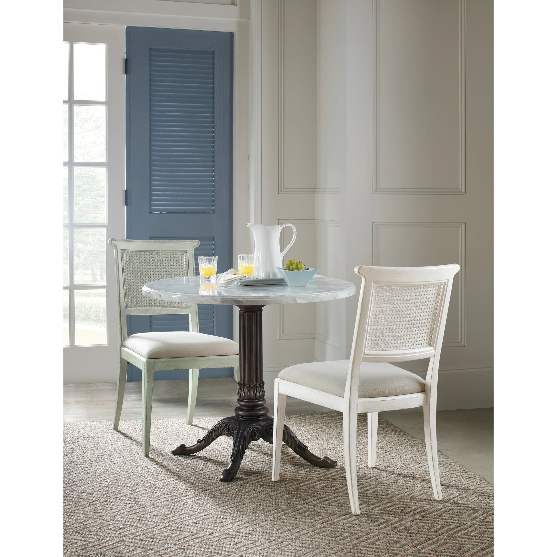 Charleston Bistro Table by Hooker Furniture in garden gate black. Made from resin with veneered carrara stone in a modern style.
