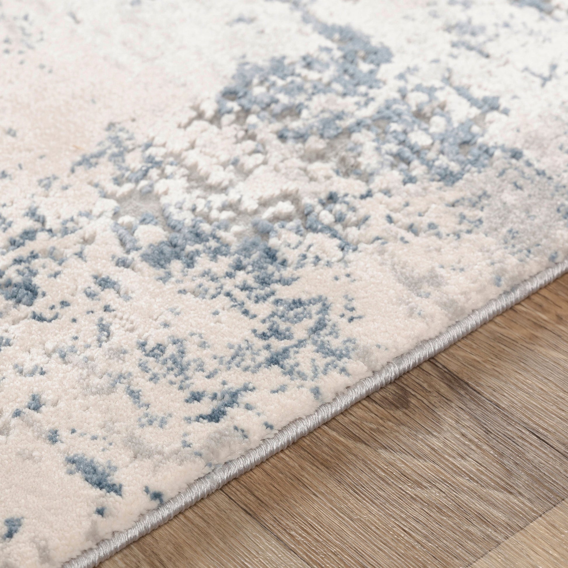 Alpine Rug by Livabliss in blue, charcoal. Made from 60% polypropylene, 40% polyester in a traditional style.
