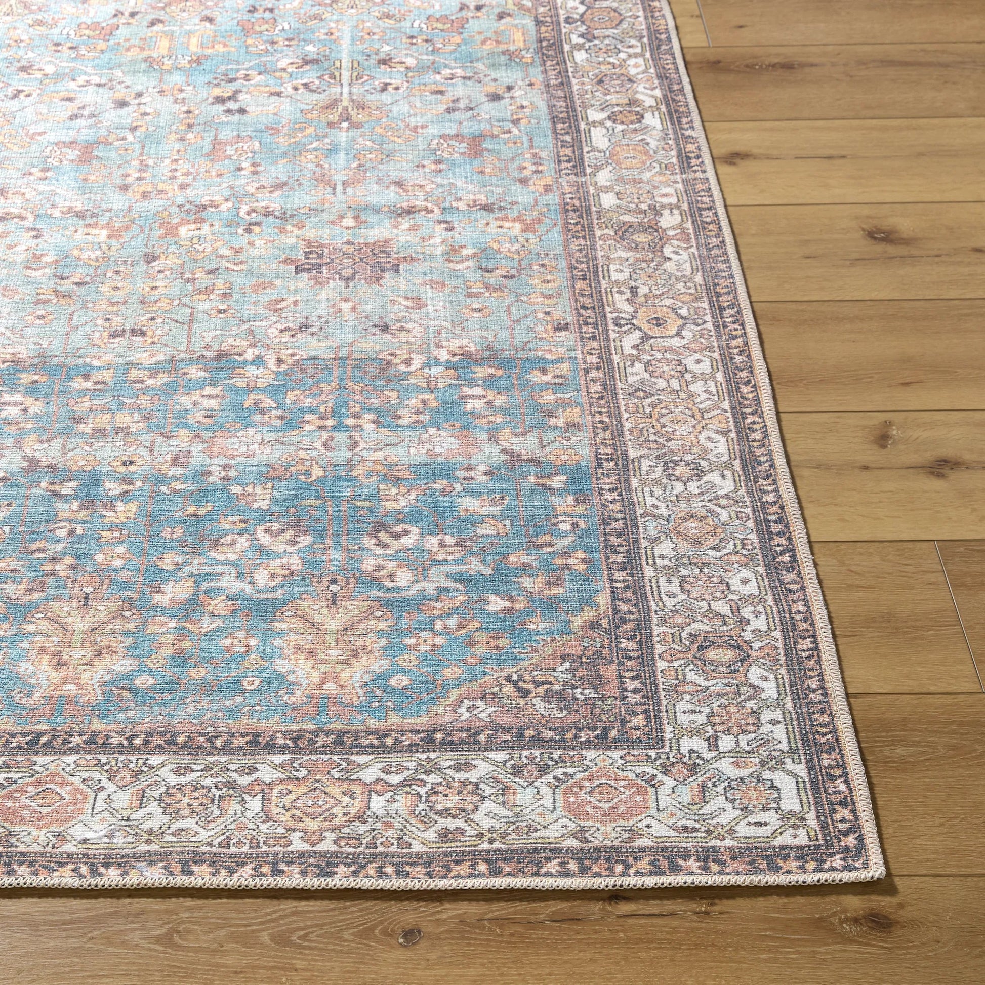 Amelie 533471 Rug by Livabliss in pale blue, teal, cream, brown, black, orange. Made from polyester in a unique style.