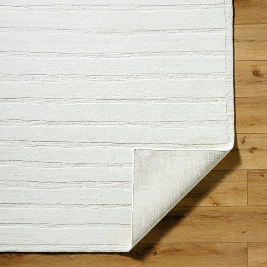 Amani Rug by Surya in cream. Made from wool in a unique style.