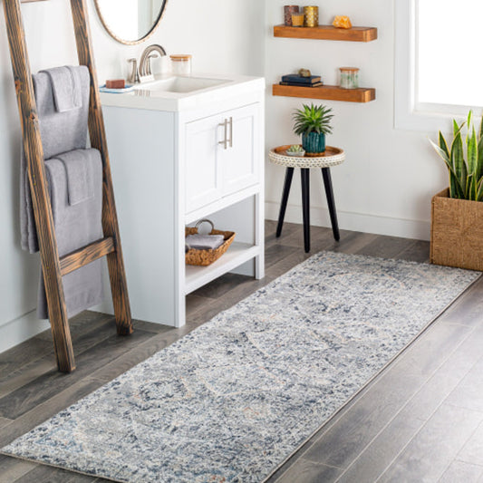 Amore Rug by Livabliss in navy, denim, gray, rust, light beige, cream. Made from 100% polyester in a traditional style.