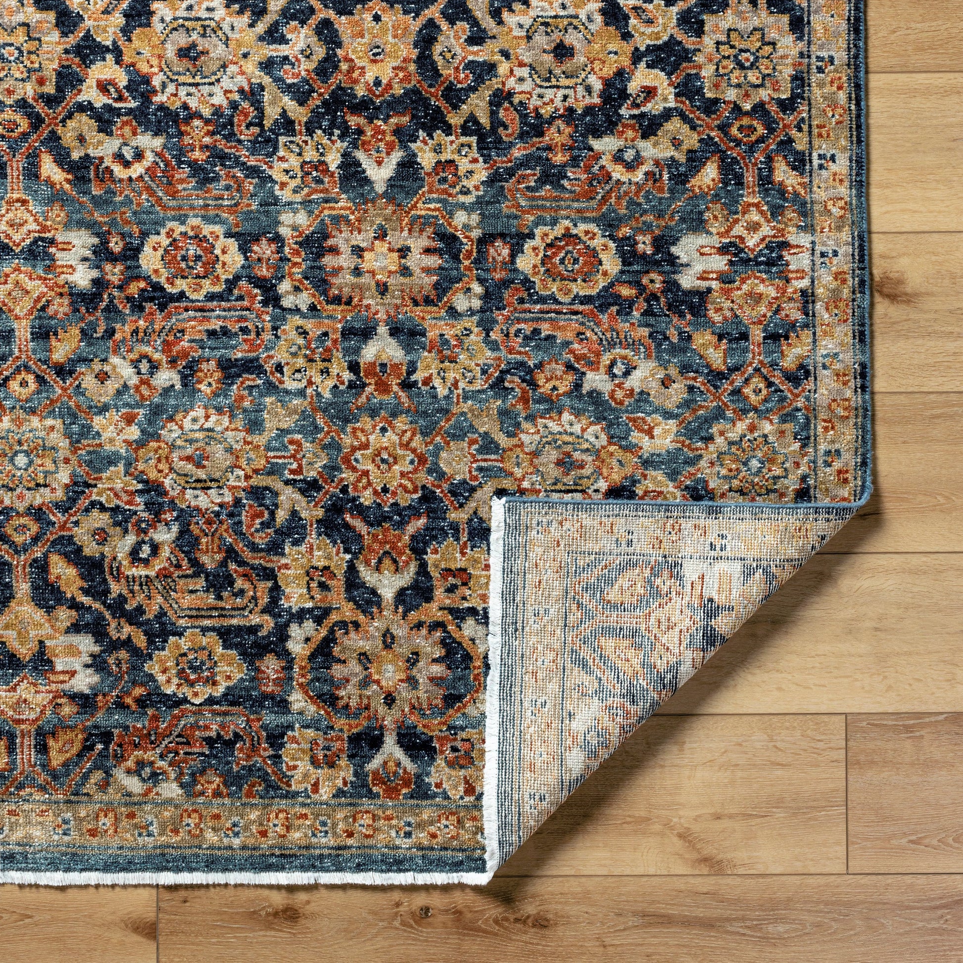 Anelka ANK-2307 Rug by Surya in navy, ivory, rust, gold, slate blue. Made from wool in a unique style.