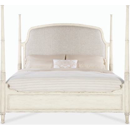 Americana California King Upholstered Poster Bed by Hooker Furniture in beige and worn white. Made from oak veneers and fabric in a traditional style.