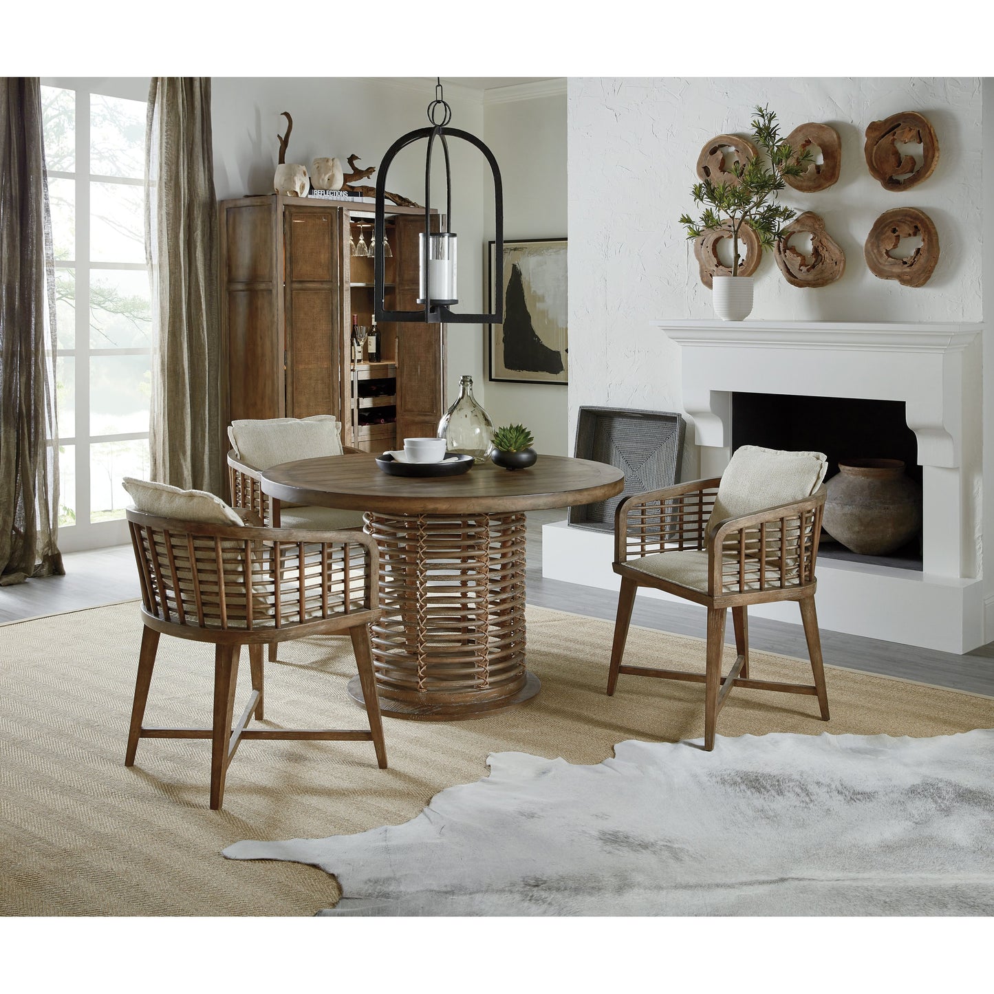 006 SI-1749788 | Lifestyle | Sundance Bar Cabinet by Hooker Furniture in cliffside. Made from pecan veneers, rattan, glass, puck light, self-closing undermount drawer guides in a transitional style.