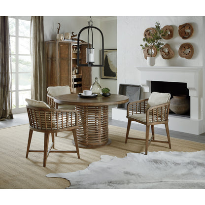 Sundance Bar Cabinet by Hooker Furniture in cliffside. Made from pecan veneers, rattan, glass, puck light, self-closing undermount drawer guides in a transitional style.