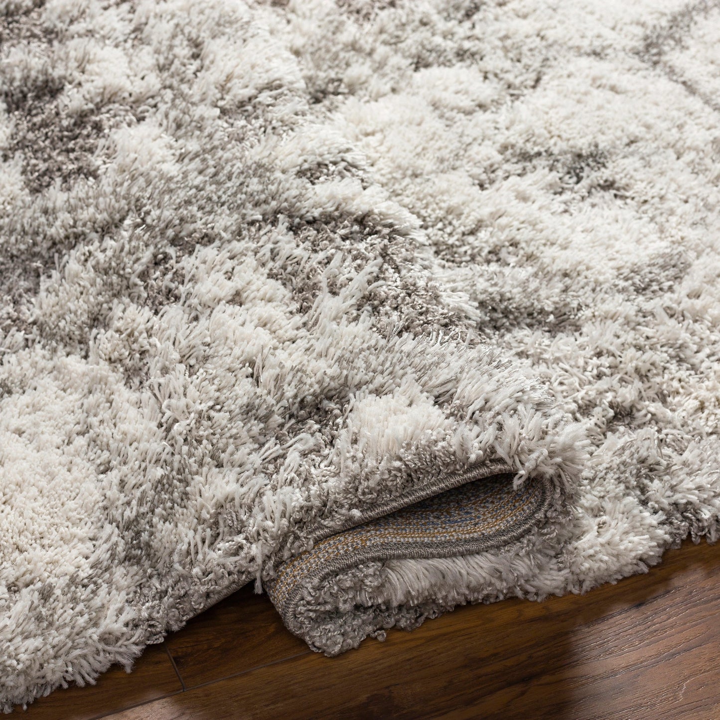 006 SI-1842753,SR-826769,SR-826770,SR-826771,SR-826772 | Closeup | Alta Shag Rug by Livabliss in light gray, off-white, medium gray. Made from 100% polypropylene in a modern style.