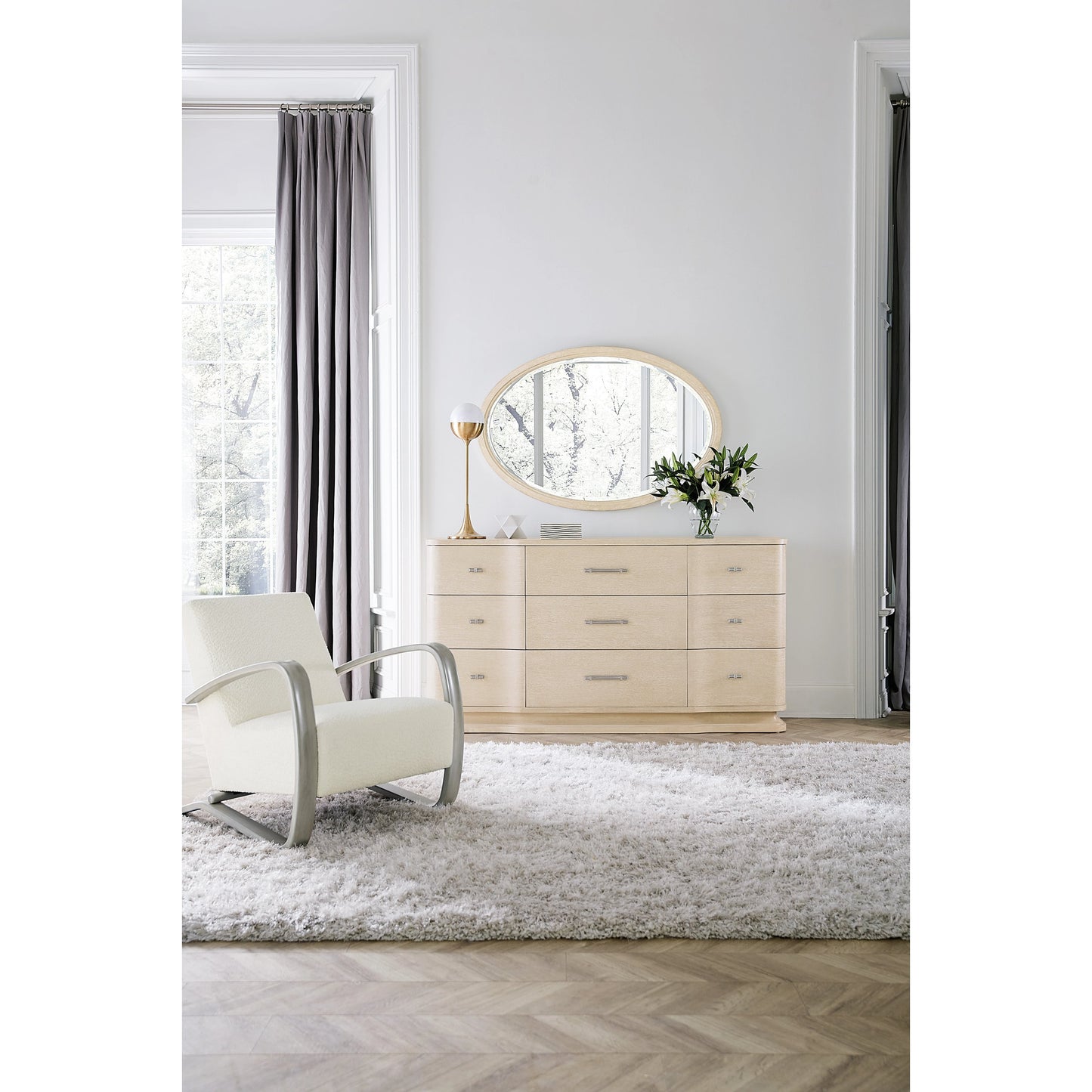 002 SI-2028946 | Lifestyle | Nouveau Chic Oval Mirror by Hooker Furniture in sandstone. Made from wood, mirror glass in a modern style.