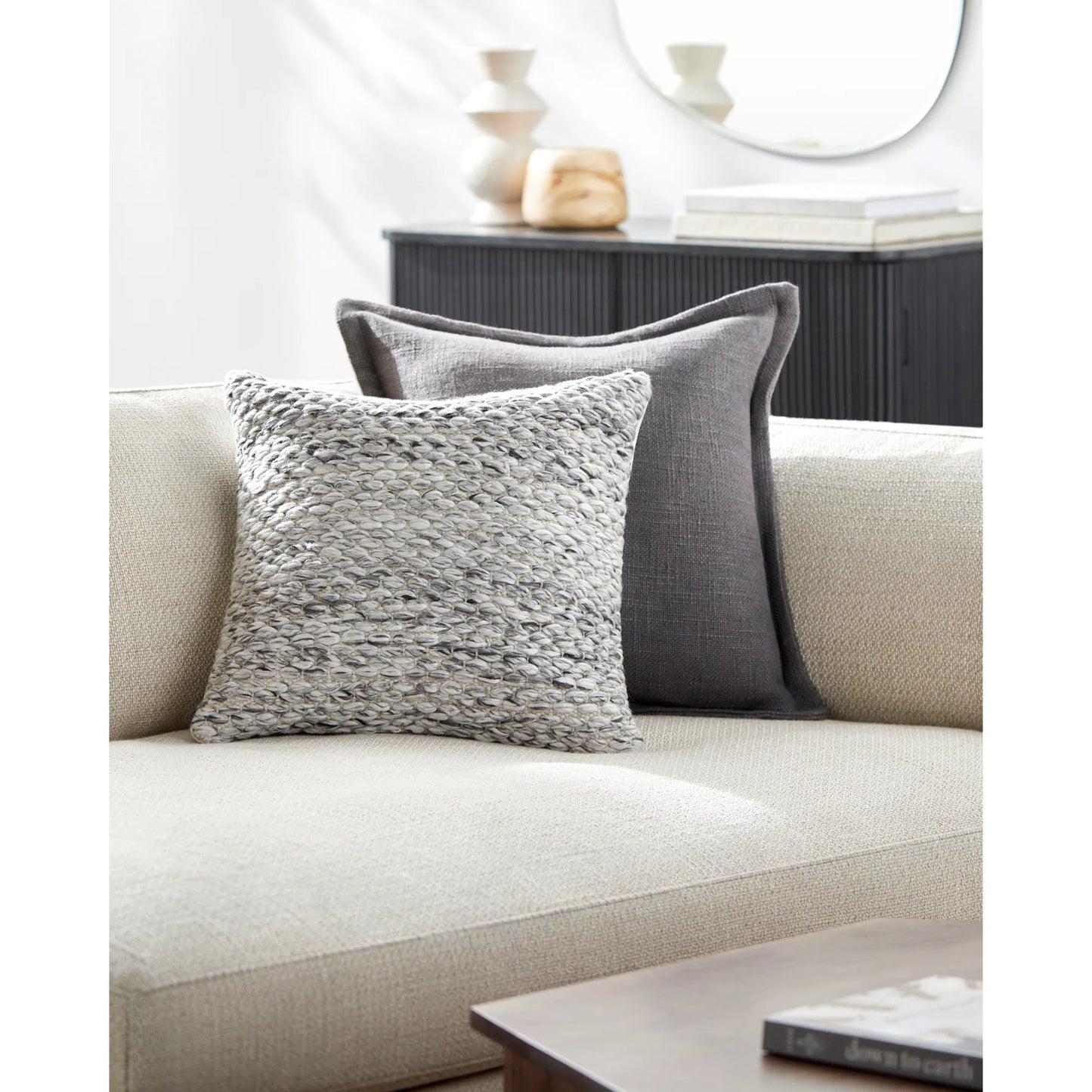 002 SI-2049397,SI-2049398,SI-2049400,SI-2049401,SI-2049403,SI-2049404 | Lifestyle | Averill Indoor/Outdoor Pillow by Livabliss in light silver, off-white, light grey, silver, ash. Made from front: 100% polyester, back: 100% polyester in a modern style.