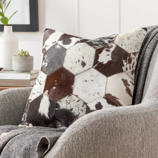 Avani Pillow by Surya in brown, light beige, dark brown, black, white. Made from front: 100% hair on hide, back: 80% polyester, 20% cotton in a modern style.