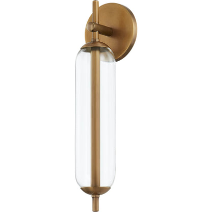 Blaze Exterior Wall Sconce by Troy in patina brass. Made from brass in a modern style.