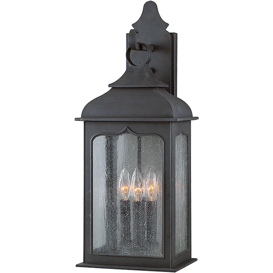Henry Street Wall Lantern by Troy in colonial iron. Made from hand forged iron in a transitional style.