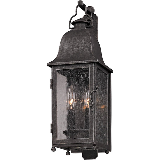 Larchmont Wall Lantern by Troy in aged pewter. Made from hand forged iron in a traditional style.