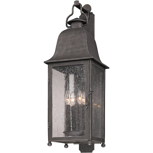 Larchmont Wall Sconce by Troy in vintage bronze. Made from hand forged iron in a unique style.