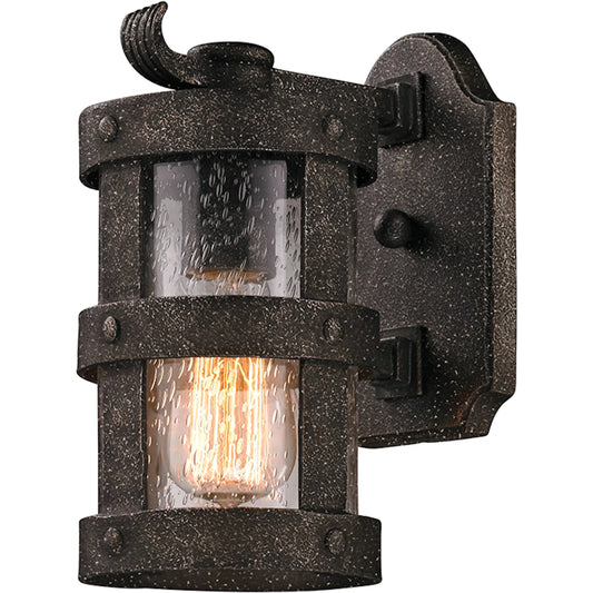 Barbosa Wall Sconce by Troy in aged pewter. Made from hand forged iron in a unique style.