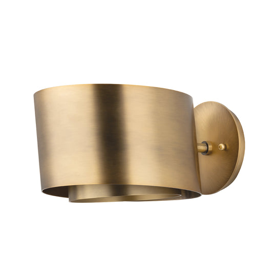 Roux Sconce by Troy in patina brass. Made from steel in a modern style.