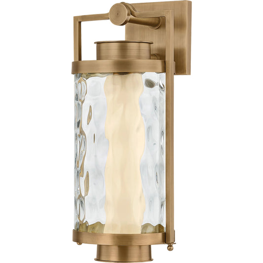 Haddock Wall Sconce by Troy in patina brass. Made from brass in a unique style.