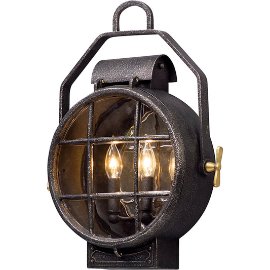 Point Lookout Wall Lantern by Troy in aged silver with pol brass accent. Made from cast aluminum in a traditional style.