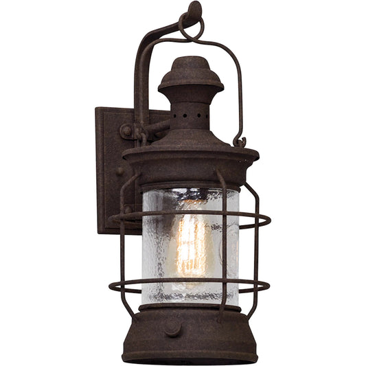 Atkins Wall Lantern by Troy in centennial rust. Made from hand worked iron, aluminum in a traditional style.