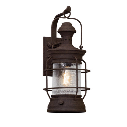 Atkins Wall Lantern by Troy in centennial rust. Made from hand-worked iron in a rustic style.