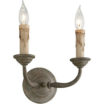 Cyrano Double Wall Sconce by Troy in earthen bronze. Made from hand worked iron in a transitional style.