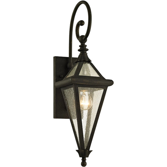 Geneva Wall Sconce by Troy in vintage bronze. Made from hand worked iron in a transitional style.