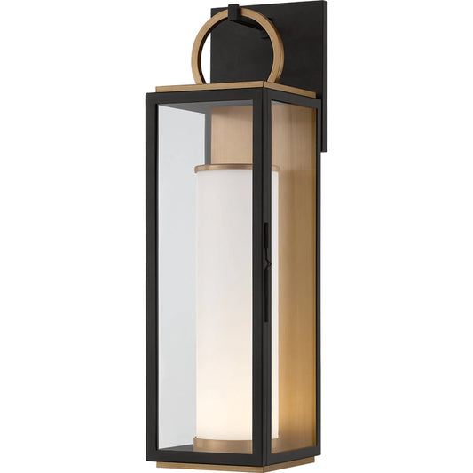 Gareth Wall Sconce by Troy in patina brass, textured black. Made from aluminum in a unique style.