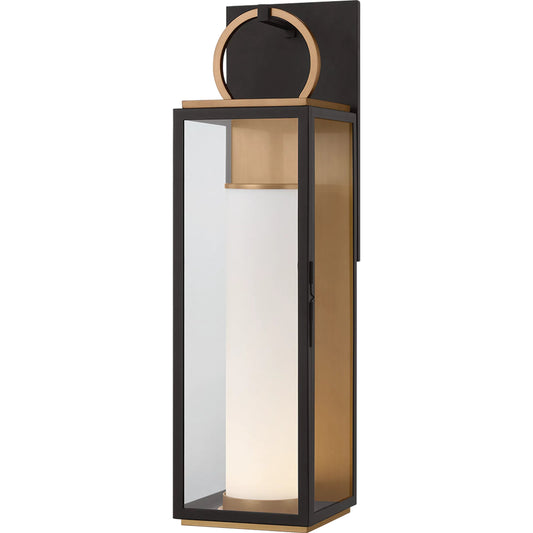 Gareth Wall Sconce by Troy in patina brass, textured black. Made from aluminum in a unique style.