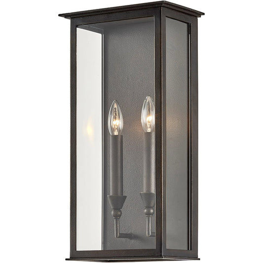 Chauncey Wall Sconce by Troy in vintage bronze. Made from hand worked iron in a modern style.