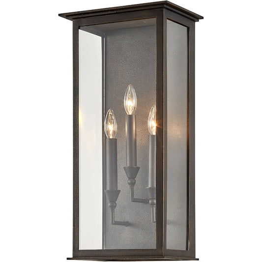 Chauncey Wall Sconce by Troy in vintage bronze. Made from hand worked iron in a modern style.