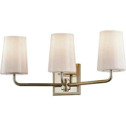 Simone Vanity Light by Troy in silver leaf polished nickel. Made from hand worked iron in a modern style.