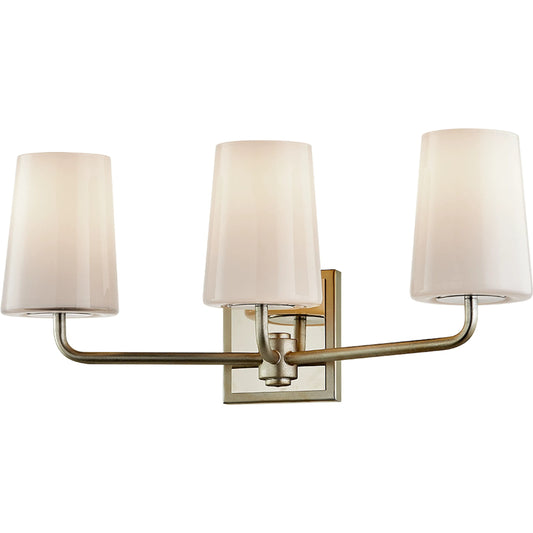 Simone Vanity Light by Troy in silver leaf polished nickel. Made from hand worked iron in a modern style.