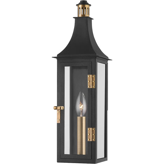 Wes Exterior Wall Sconce by Troy in patina brass. Made from aluminum in a traditional style.