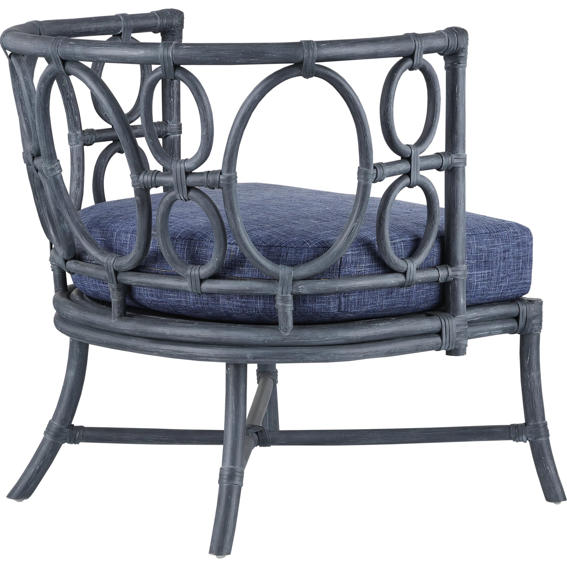 Tegal Chair by Currey and Company in vintage navy, indigo. Made from rattan, plywood, fabric, foam in a coastal style.