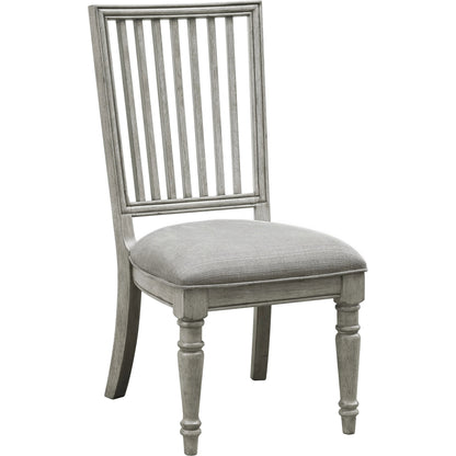 Madison Ridge Side Chair (Set of 2) by Pulaski Furniture in bluff grey. Made from asian hardwood, oak veneers, fabric in a traditional style.