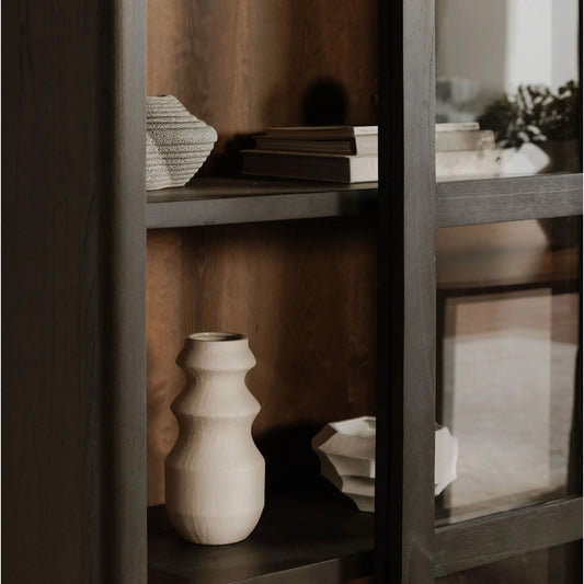 Mona Cabinet by Moe's Home Collection in black. Made from solid neem wood, tempered glass, pine veneer back, iron t bar in a unique style.