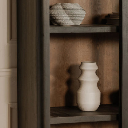 Mona Cabinet by Moe's Home Collection in black. Made from solid neem wood, tempered glass, pine veneer back, iron t bar in a traditional style.