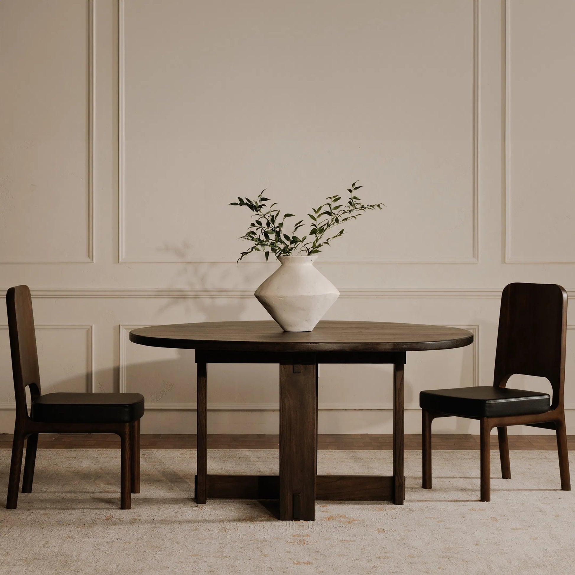 Glenn Round Dining Table by Moe's Home Collection in dark brown. Made from solid neem wood, iron bar, connecting plates in a traditional style.