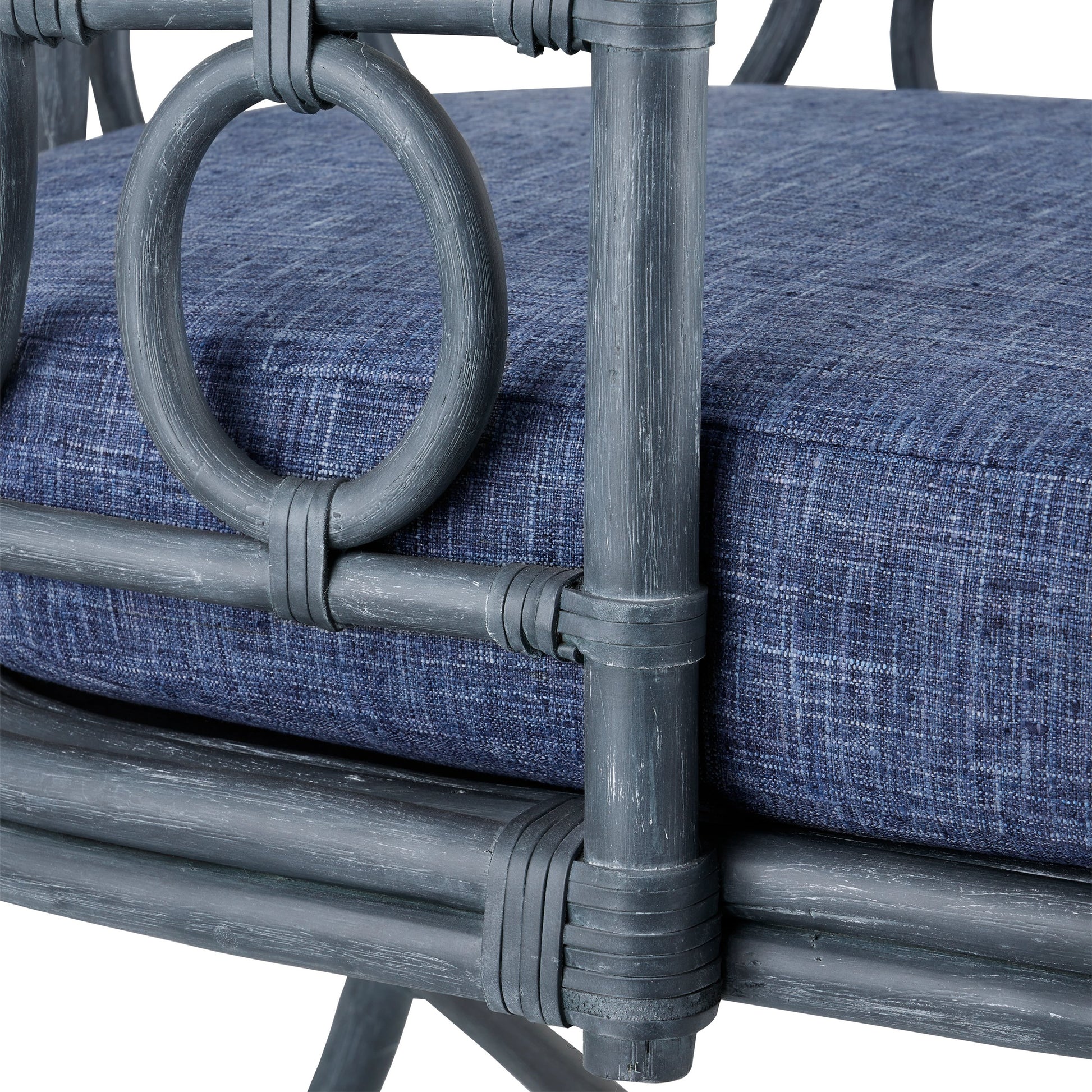 Tegal Chair by Currey and Company in vintage navy, indigo. Made from rattan, plywood, fabric, foam in a coastal style.