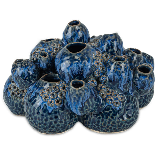 Sulawasi Shells by Currey and Company in reactive dark blue. Made from ceramic in a unique style.
