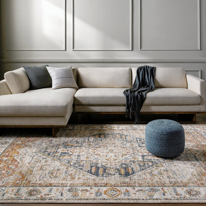 Beckham Rug by Livabliss in off-white, amber, charcoal, light slate, ice blue, medium brown. Made from main: 100% polyester in a traditional style.