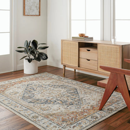 Beckham Rug by Livabliss in off-white, amber, charcoal, light slate, ice blue, medium brown. Made from main: 100% polyester in a traditional style.