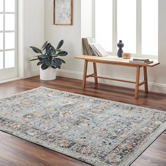 Beckham Rug - 33065 by Livabliss in ice blue, off-white, medium gray, charcoal, medium brown, amber. Made from main: 100% polyester in a unique style.