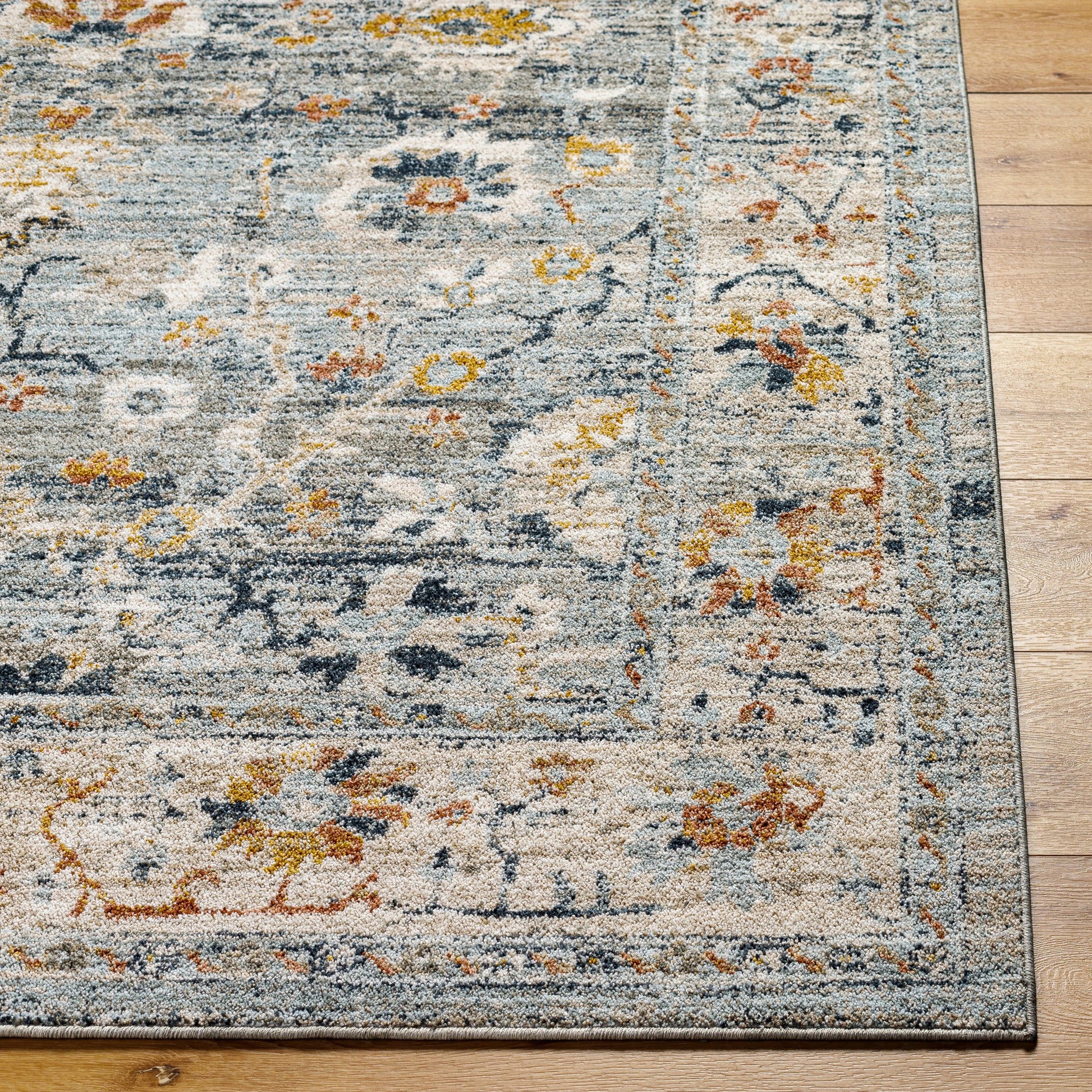 Beckham Rug - 33066 by Livabliss in medium gray, off-white, ice blue, charcoal, medium brown, amber. Made from main: 100% polyester in a unique style.