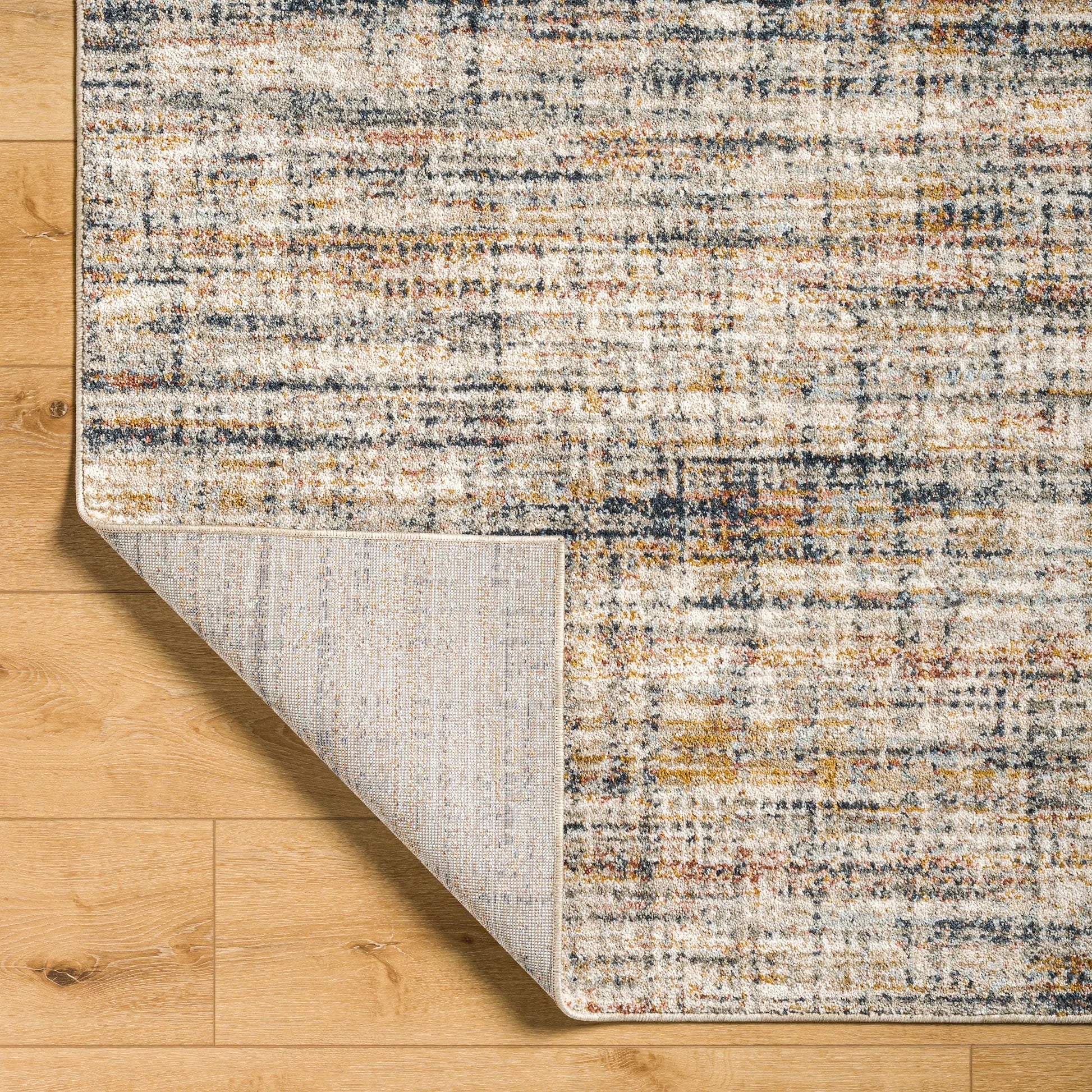 Beckham Rug - 33070 by Livabliss in off-white, light slate, ice blue, charcoal, amber, medium brown. Made from main: 100% polyester in a unique style.