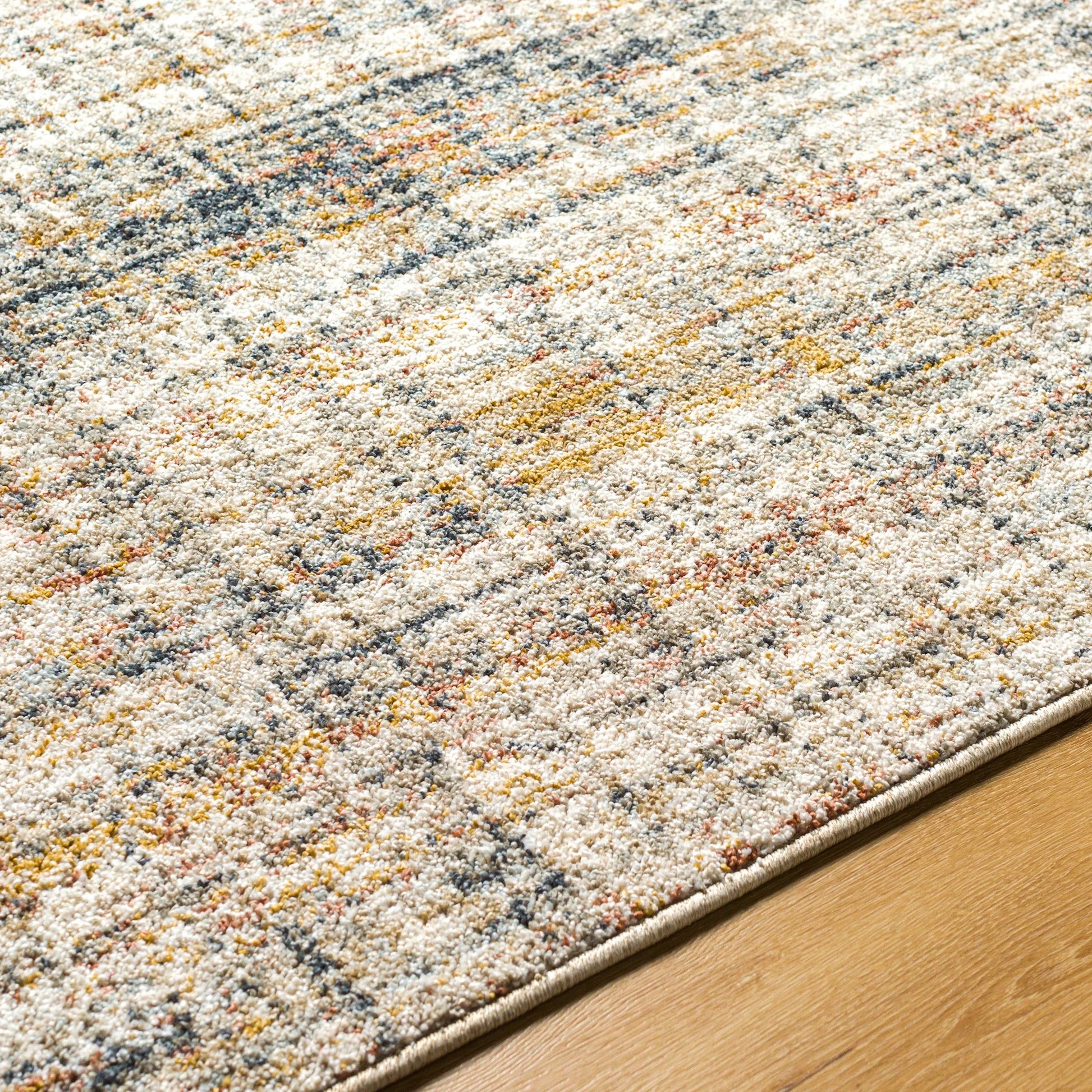 Beckham Rug - 33070 by Livabliss in off-white, light slate, ice blue, charcoal, amber, medium brown. Made from main: 100% polyester in a unique style.