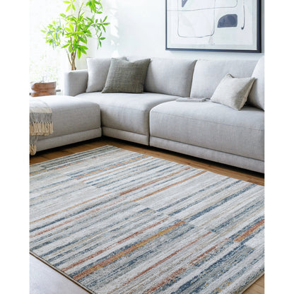 Beckham Rug - 33083 by Livabliss in light slate, off-white, charcoal, medium brown, ice blue, amber. Made from main: 100% polyester in a unique style.